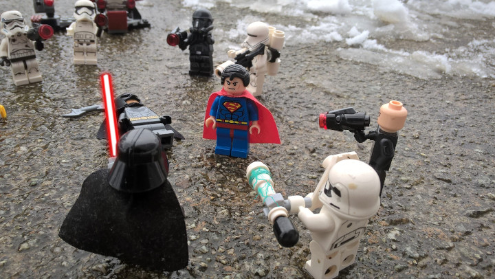 Superman landed, was slowly walking towards Darth Vader. He knew enough about Darth Vader manipulating doctor to prepare Mr. Farty for transport away from the hospital. Then, this villain did something, that nobody seen him and disappeared with his friend on the edge of life and death. He kidnapped him who knows where, but Superman found this Vader in the middle of the battlefield, his friends were unconscious. But he didn't want to spill blood of the soldiers without purpose, they might be manipulated similarly as the doctor.
Darth Vader knew, that this opponent won't be just a piece of cake. Strength, certainity and anger spread from him. He didn't know, what to expect of this opponent. He didn't knew what to expect. He didn't even know his abilities, but the Force whispered to him to be alerted. But for now, he will not rely on stupid soldier, instead will kill him by himself.
Superman: "So, I finally found you. I know you kidnapped my friend, Batman and Harley. Therefore it is a time for surrended or fight. I advice you the first option!"
Darth Vader didn't speak a word, just gripped the hilt of lightsaber more tightly.
